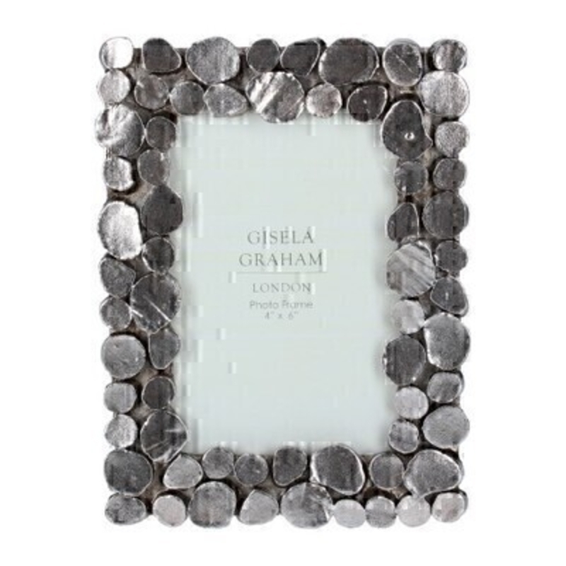 Small Pewter Pebble Picture Frame By Gisela Graham This small pewter picture frame features a pebble design and fits a 4 x 6 inch photo. Made by London based designer Gisela Graham who designs really beautiful gifts for your home and garden.  This pebble photo frame would suit any home decor and would make a lovely gift. Matching larger photo frame also available.